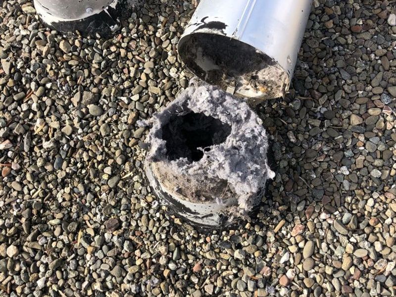 Heavy lint buildup removed from a residential dryer vent