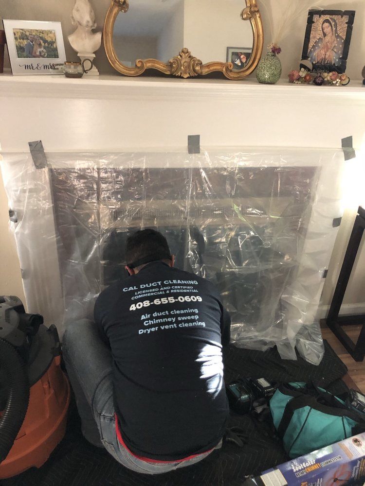 Cal Duct Cleaning chimney technician servicing a Bay Area fireplace